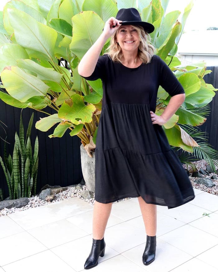 Bev wearing a tiered dress with booties | 40plusstyle.com