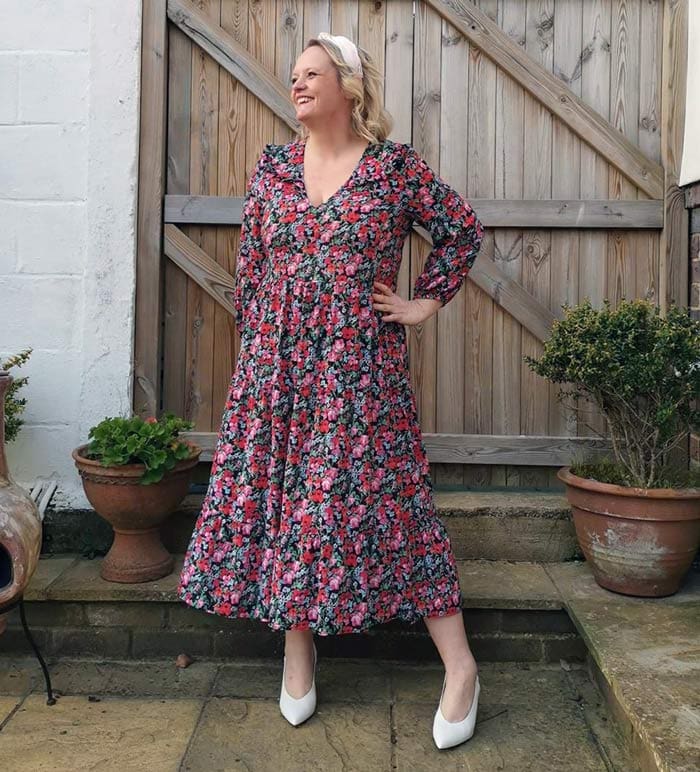 Caroline wearing an 80s-style floral dress | 40plusstyle.com