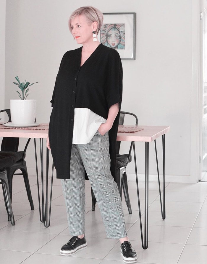 Deborah wearing an asymmetrical top and plaid pants | 40plusstyle.com