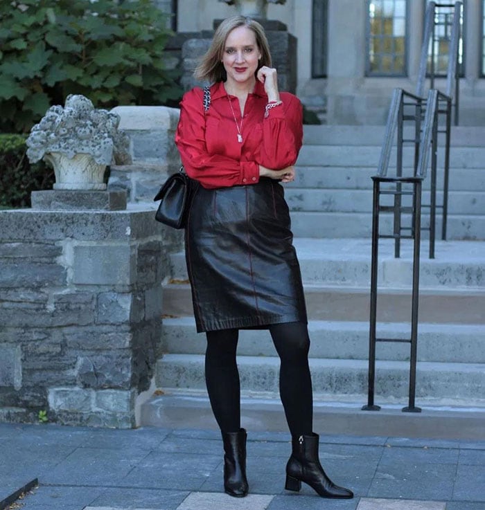 Casual party outfits - Ashley wearing a leather skirt and satin blouse | 40plusstyle.com