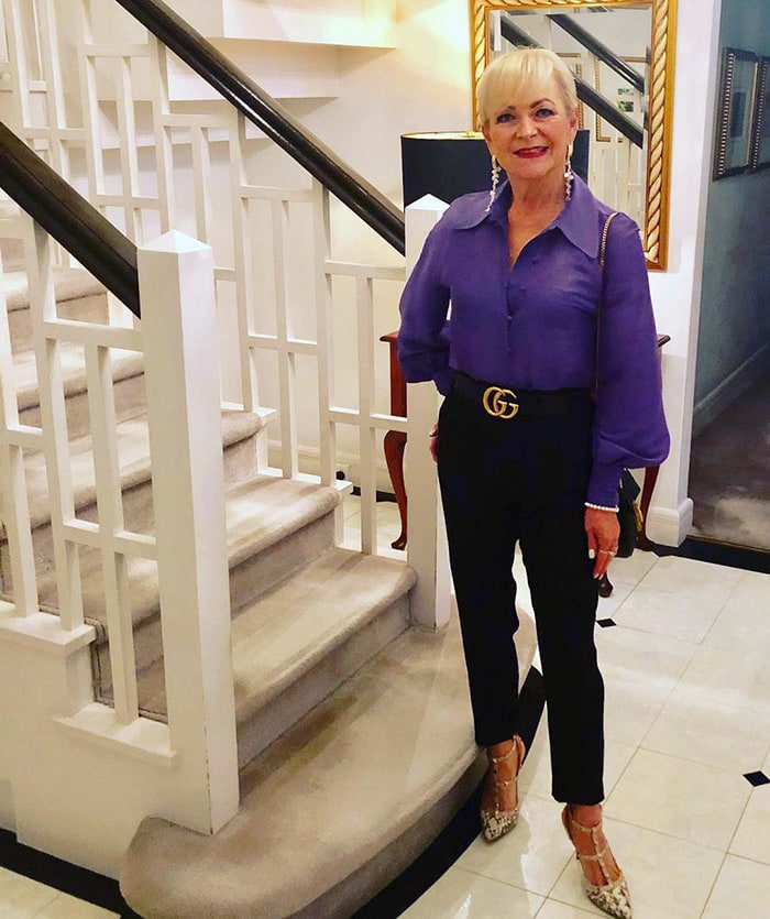 Purple outfits - Marina wearing a purple blouse and black pants | 40plusstyle.com