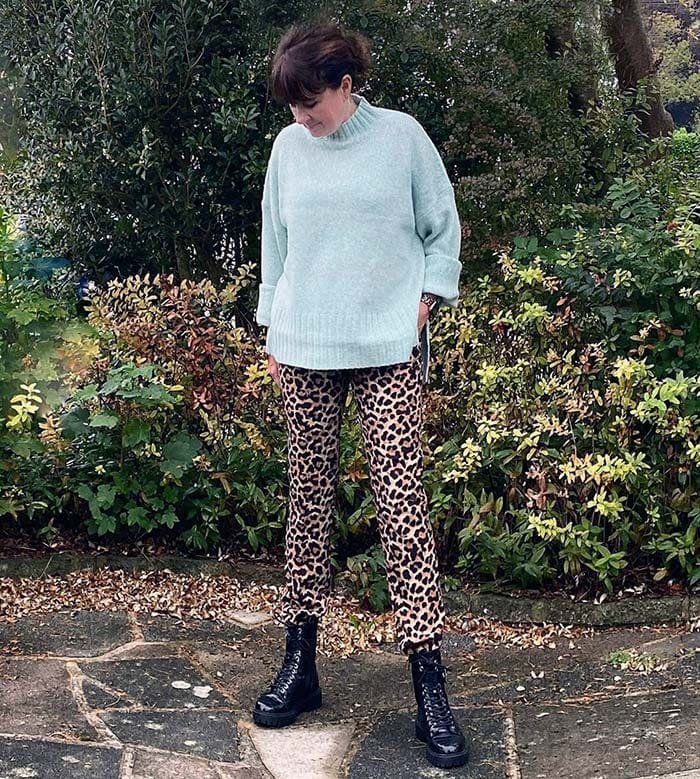 Michelle in a wool sweater and lace-up boots with leopard print pants | 40plusstyle.com