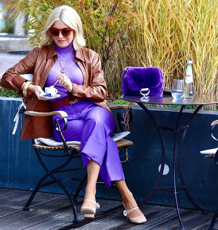 Petra wearing purple pants and a matching top | 40plusstyle.com