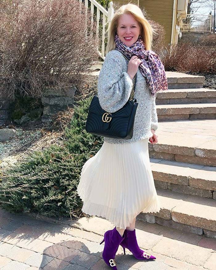 Ruisio wears purple boots with her outfit | 40plusstyle.com