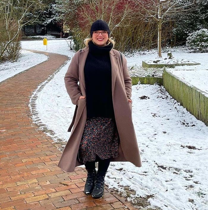 Katharina wears a coat over her winter skirt | 40plusstyle.com