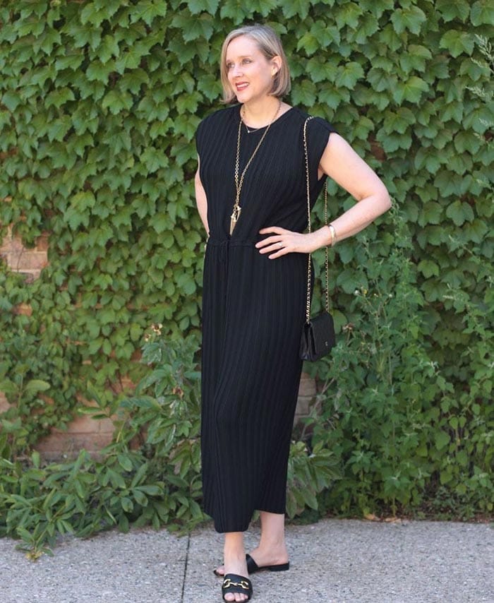 Ashley in a black dress with long necklace | 40plusstyle.com