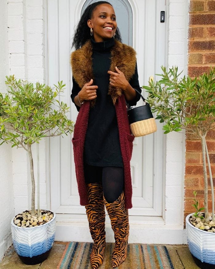 Mejacal wears a long vest over her turtleneck | 40plusstyle.com