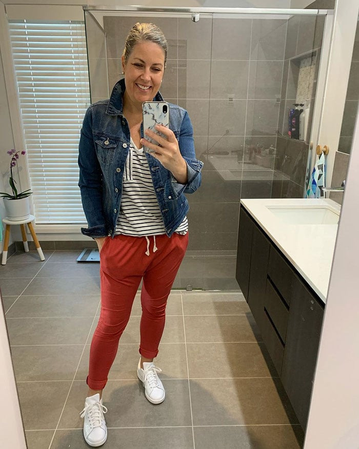 Beth in track pants and a denim jacket | 40plusstyle.com