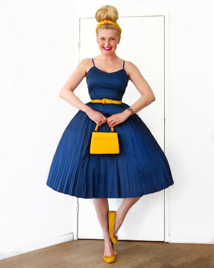 Carin in a yellow headband and blue dress | 40plusstyle.com