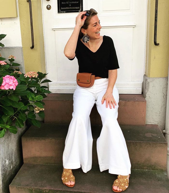 How to wear palazzo pants: your guide to putting together the best palazzo pants outfits | Sophie @stylemixers in black and white outfit | 40plusstyle.com