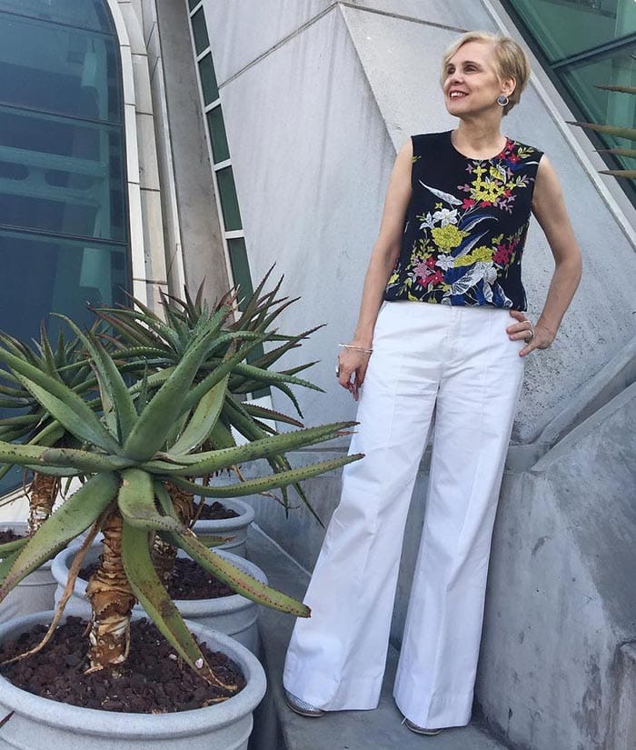 Sylvia in white jeans and a floral top | 40plusstyle.com