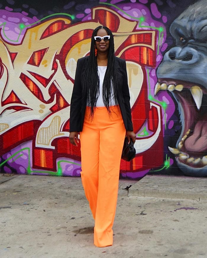 Tanasha in orange pants | 40plusstyle.com