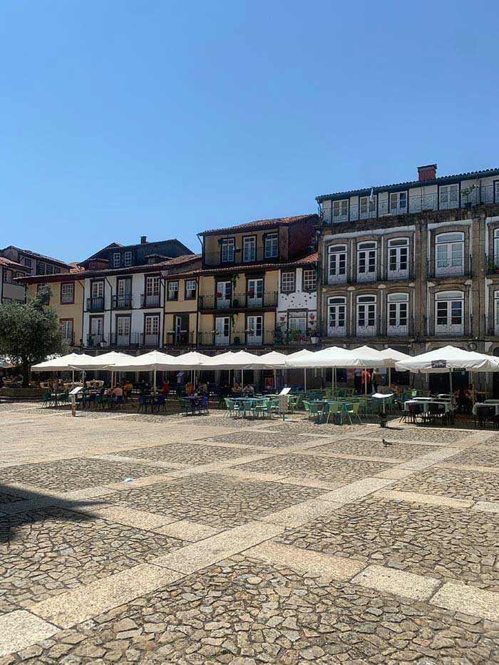 One of the big squares in Guimaraes, Portugal | 40plusstyle.com