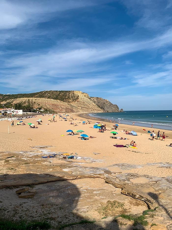 People enjoying Praia da Luz beach | 40plusstyle.com