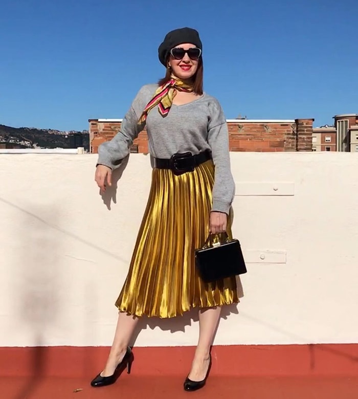 Patricia in a black beret and gold skirt | 40plusstyle.com