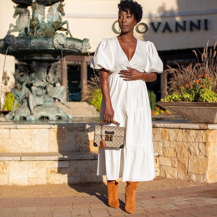 Angela wears a white dress and long boots | 40plusstyle.com