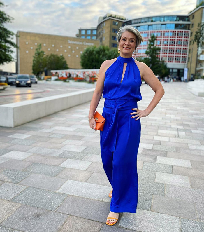 How to dress for a Christmas party - Nikki in a blue jumpsuit | 40plusstyle.com