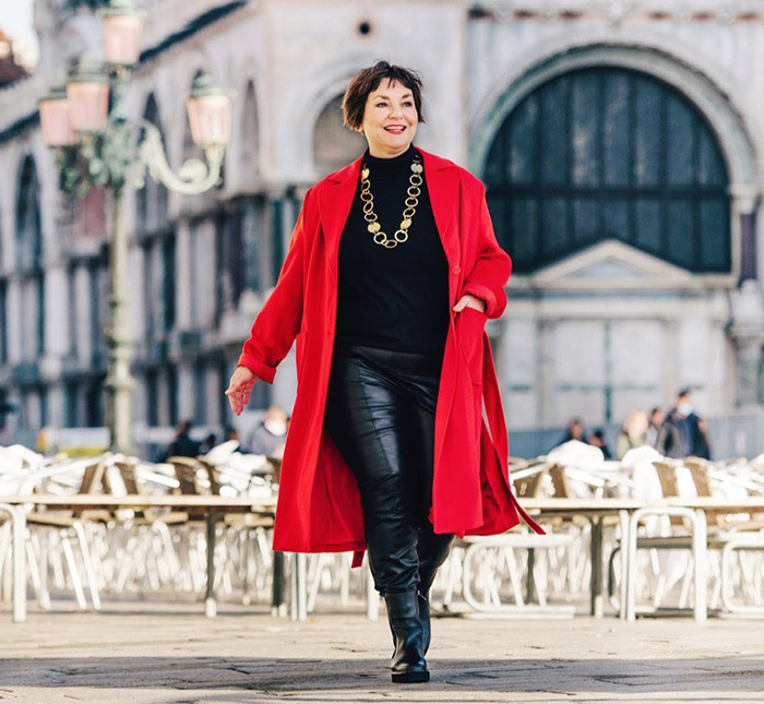 Susanne in leather pants and a red coat | 40plusstyle.com