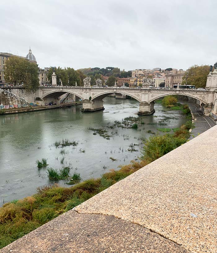 One month in Rome - the river Tiber in Rome and one of the many roman bridges | 40plusstyle.com