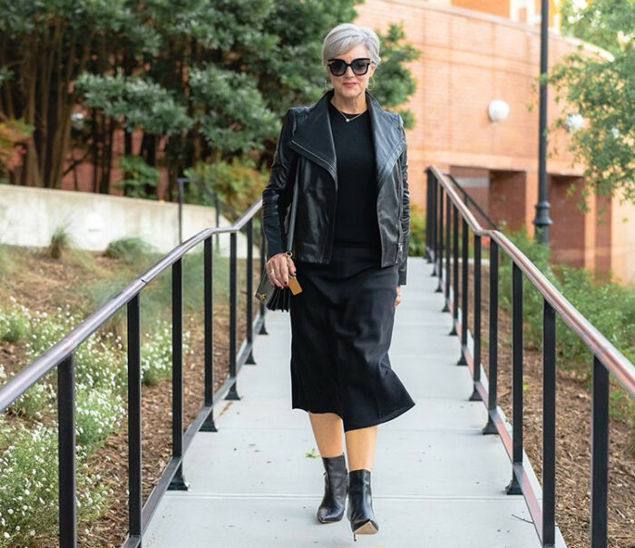 Clothes for older women - Beth in a midi skirt, leather jacket and booties | 40plusstyle.com