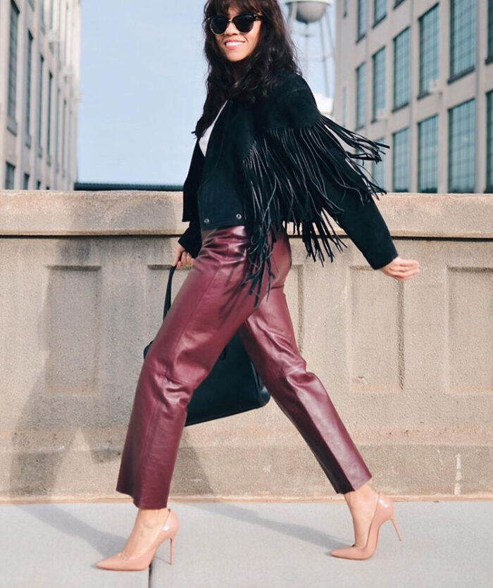Leather pants outfits - Carelia wears burgundy pants | 40plusstyle.com
