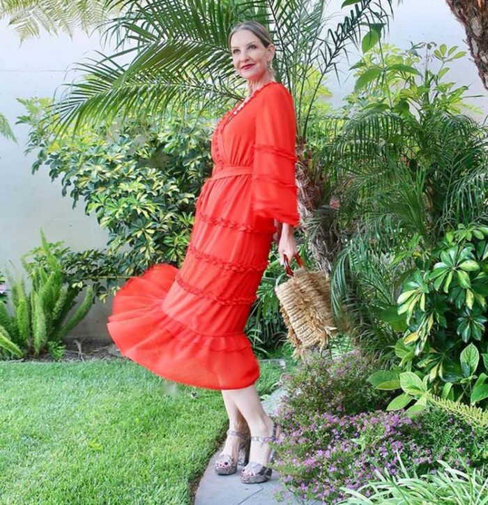 Dawn Lucy in a red dress with sleeves | 40plusstyle.com