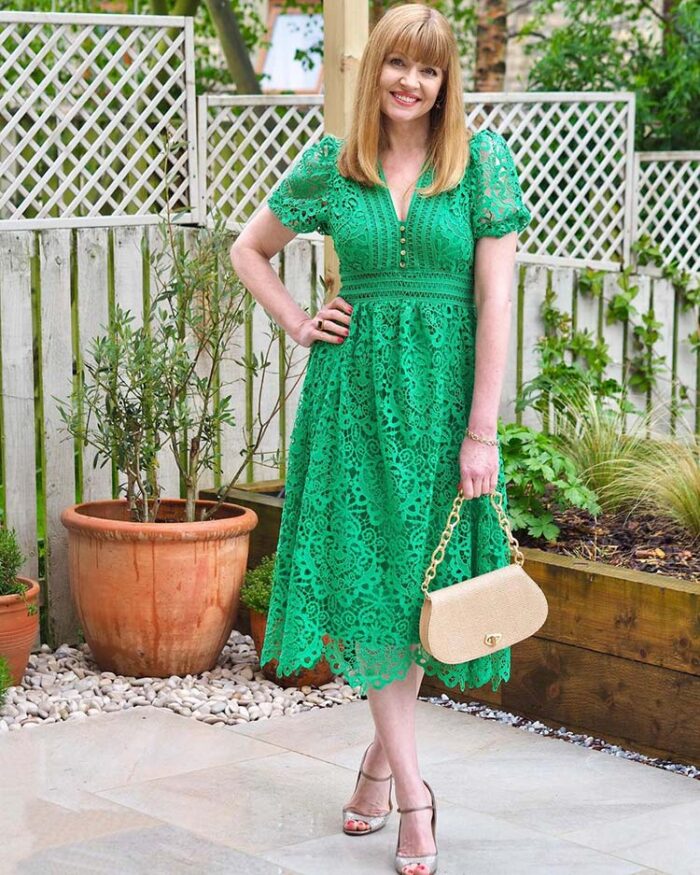 Lizzy in a green lace dress with sleeves | 40plusstyle.com