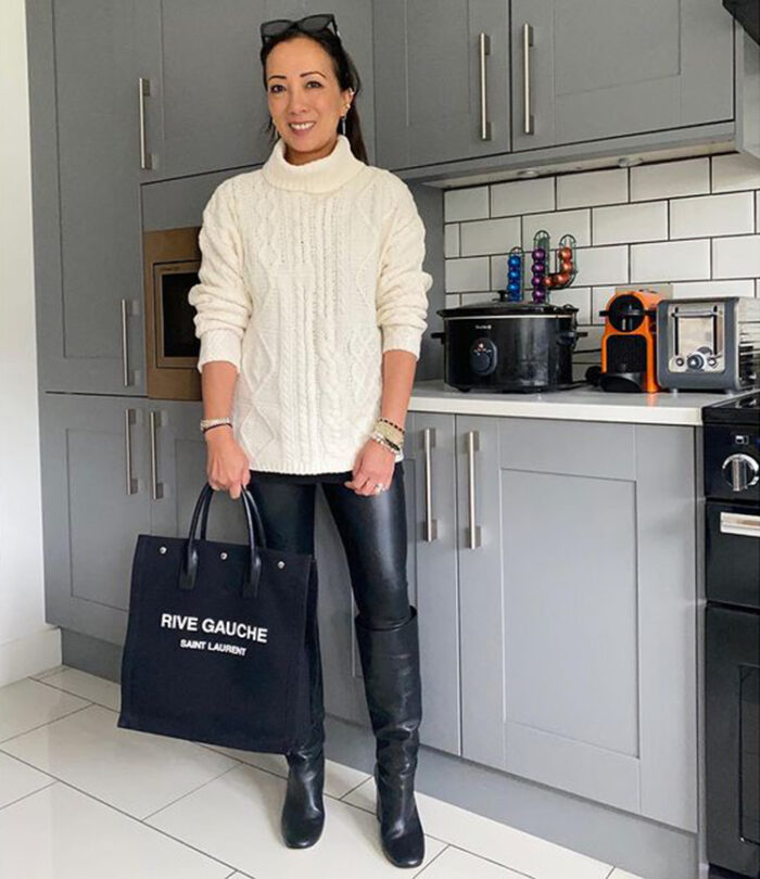 Abi in cable knit sweater, leather leggings, knee high boots and tote | 40plusstyle.com