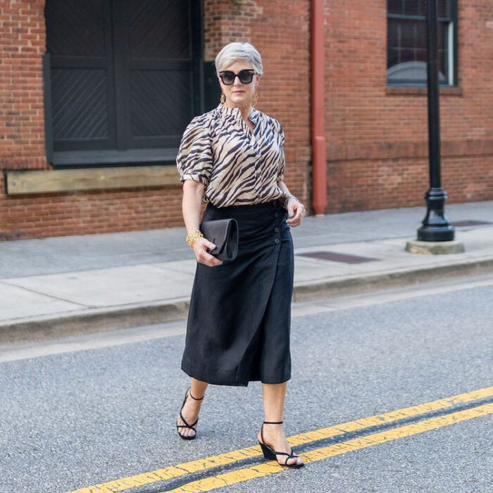 Beth in a blouse and black skirt | 40plusstyle.com