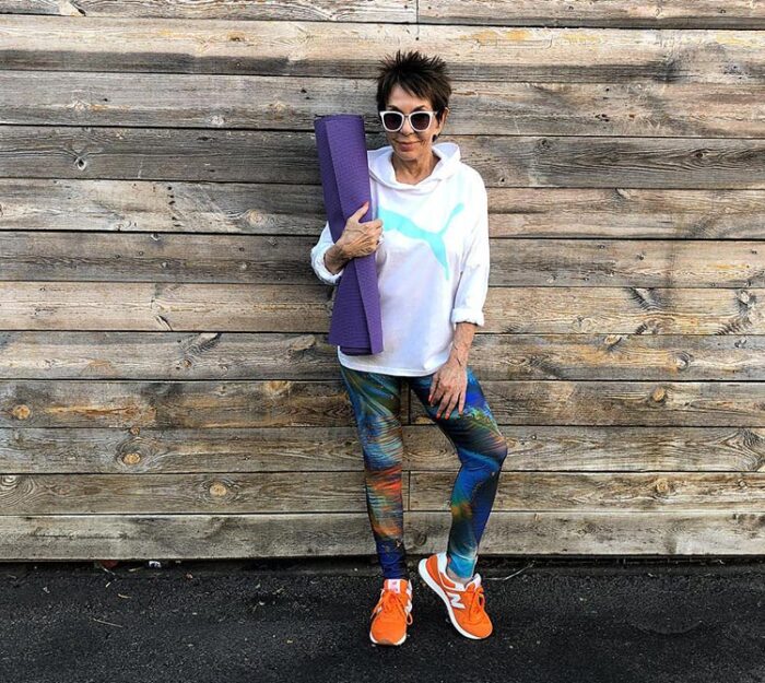 workout clothes for women - Dorrie in print leggings and orange sneakers | 40plusstyle.com