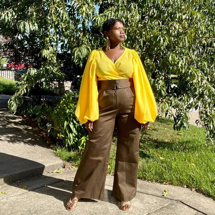 Georgette wears a bright yellow top and flared pants | 40plusstyle.com