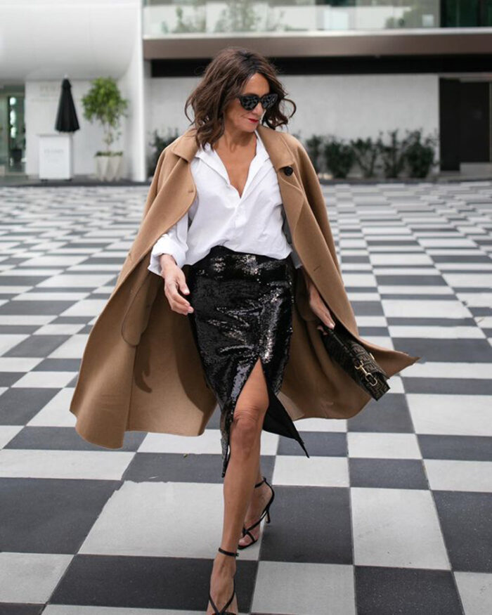 Sylvia in white shirt, sequin skirt, coat and sandals | 40plusstyle.com