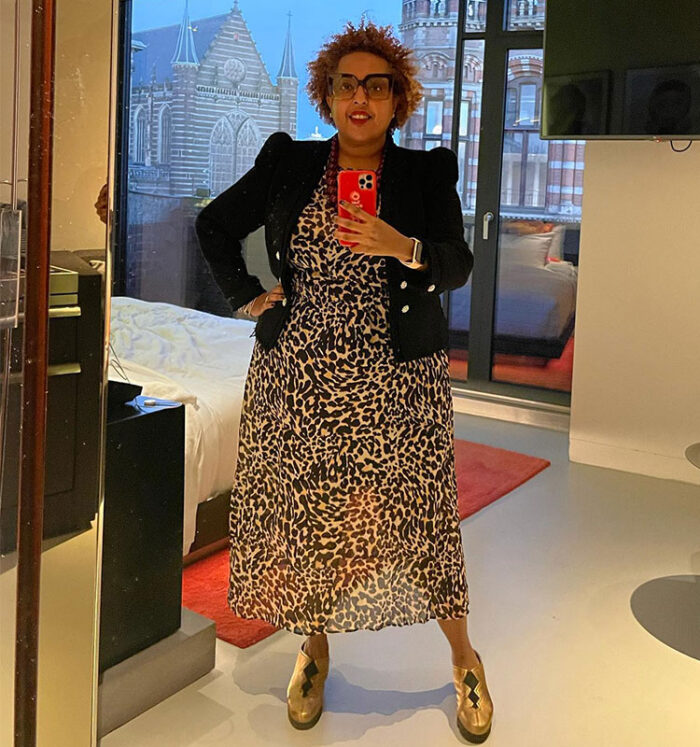 Lydia wears a leopard dress with blazer and gold heels | 40plusstyle.com