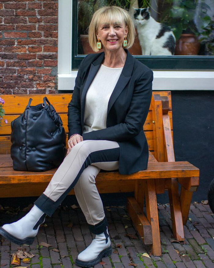 Greetje wears white boots with a neutral outfit | 40plusstyle.com