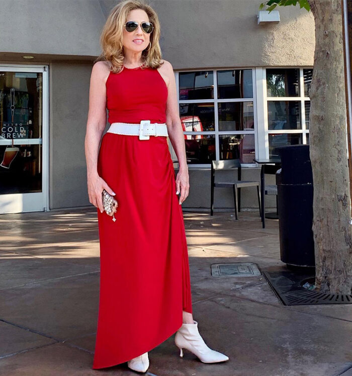 Wendy wears white boots with a red dress | 40plusstyle.com