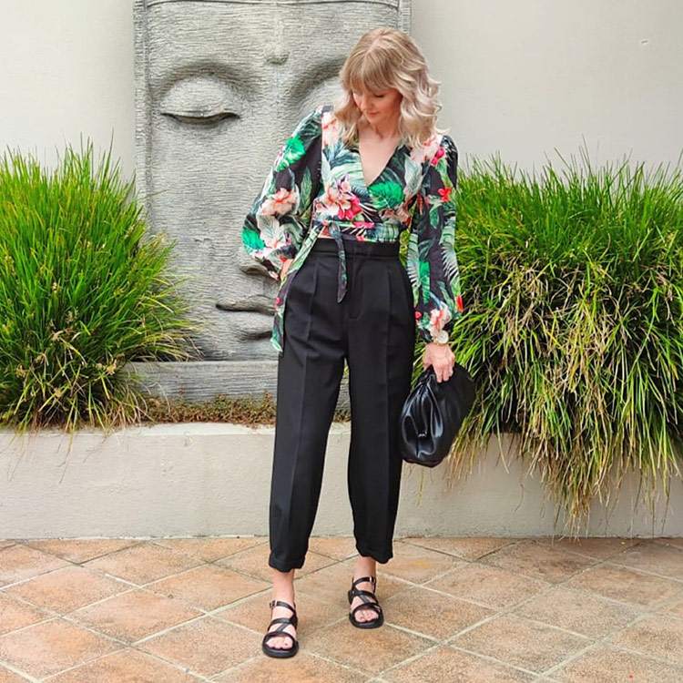 Melissa in crop floral top, cropped pants, sandals and clutch | 40plusstyle.com