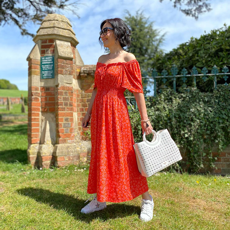 Emms wears a maxi dress and sneakers | 40plusstyle.com