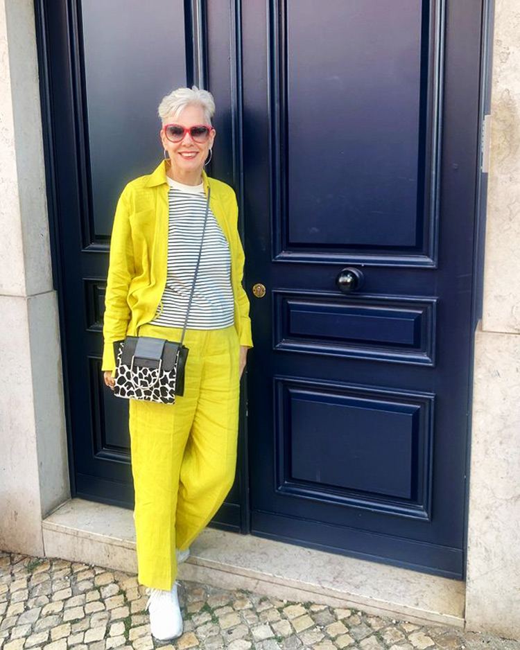 Sylvia wears a yellow suit | 40plusstyle.com