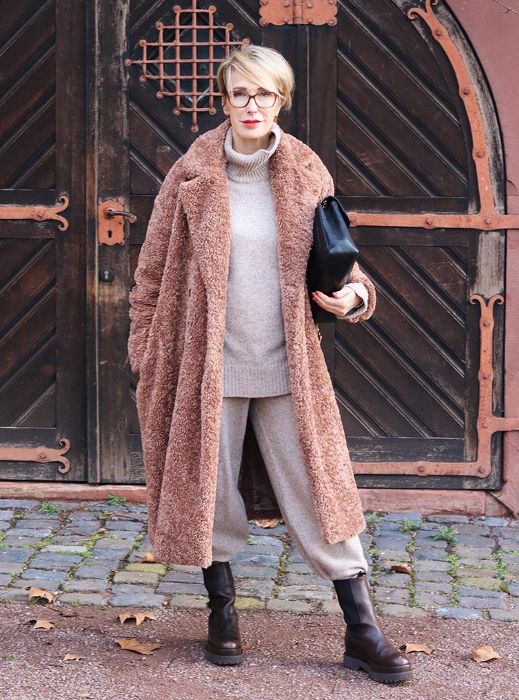 Best winter coats for women - Claudia wears a faux fur coat | 40plusstyle.com