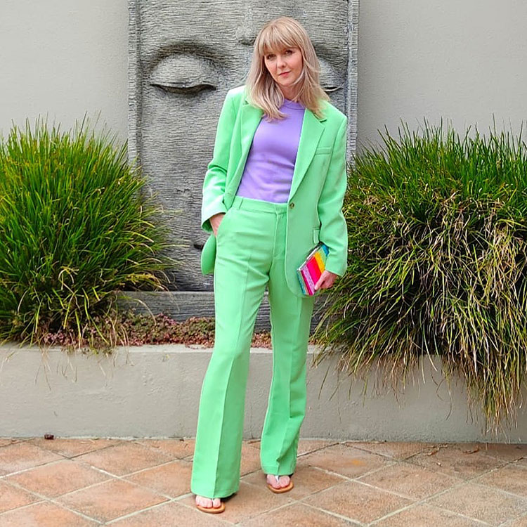 Melissa teams her green suit with a purple top | 40plusstyle.com