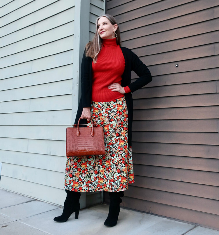 Dawn Lucy in a floral skirt and black knitwear | 40plusstyle.com