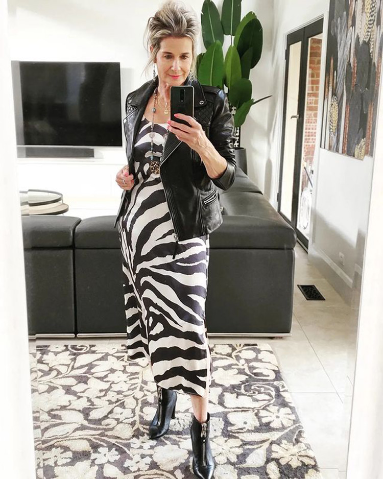 Susan in printed dress, moto jacket and booties | 40plusstyle.com