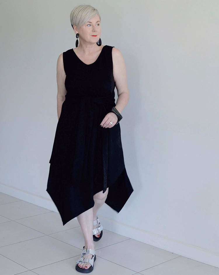 Perfect little black dress- Deborah wears an asymmetric dress | 40plusstyle.com
