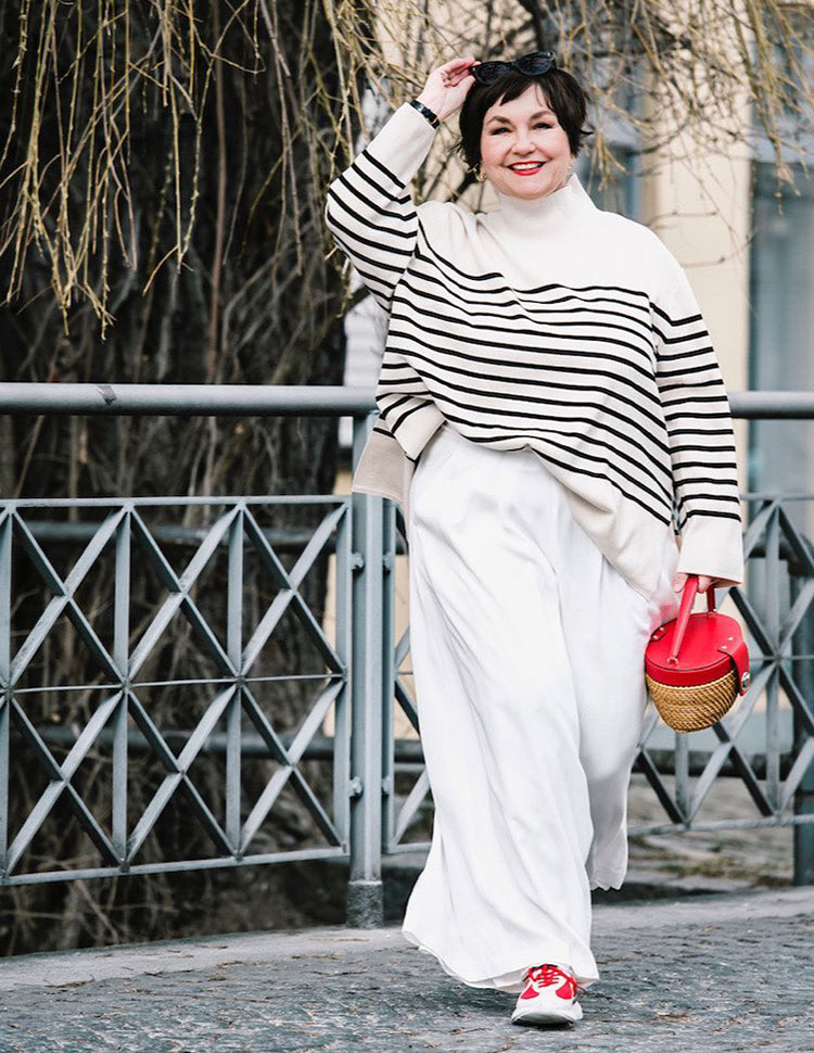 Susanne wears a striped sweater and wide pants | 40plusstyle.com