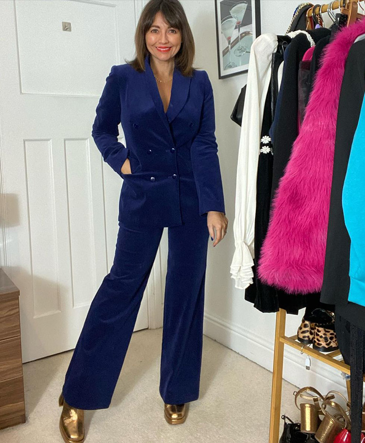 Nikki in a blue suit and gold boots | 40plusstyle.com