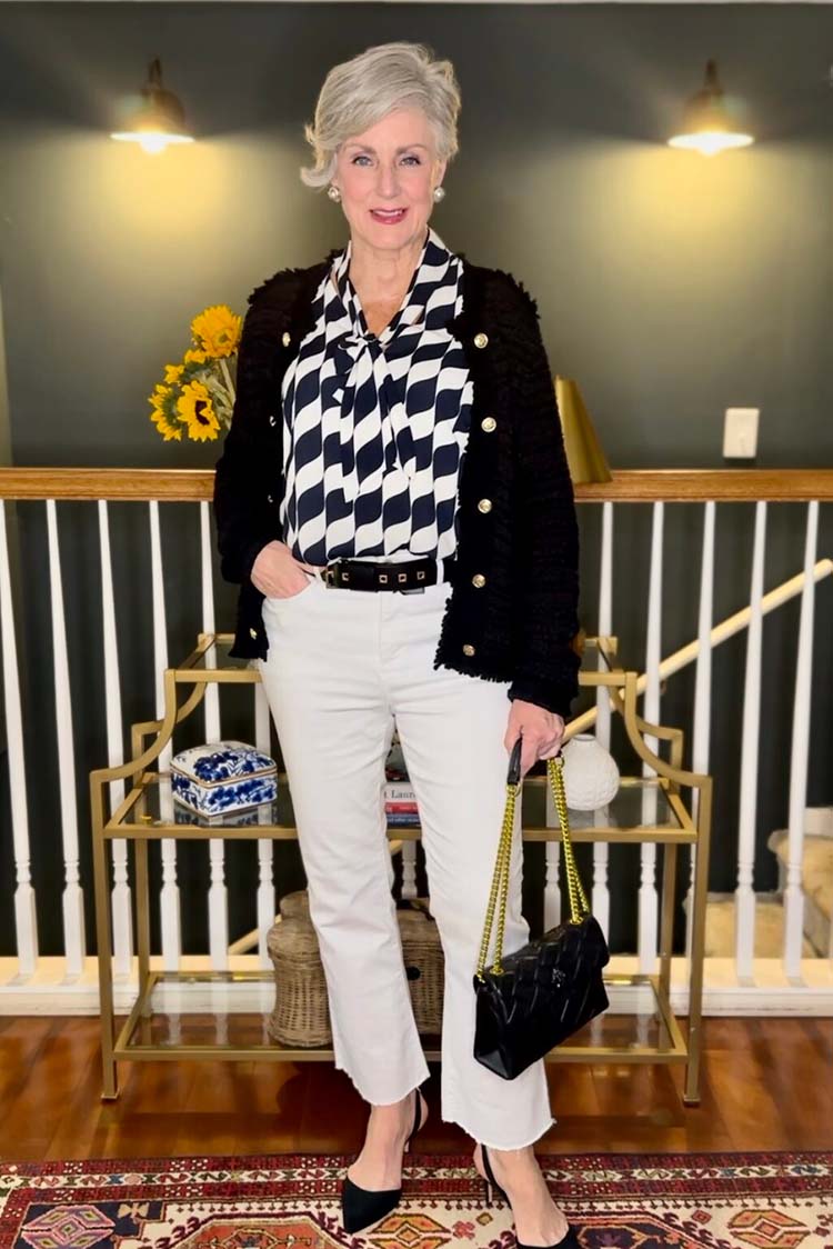 Beth wears a black and white top with her white jeans | 40plusstyle.com