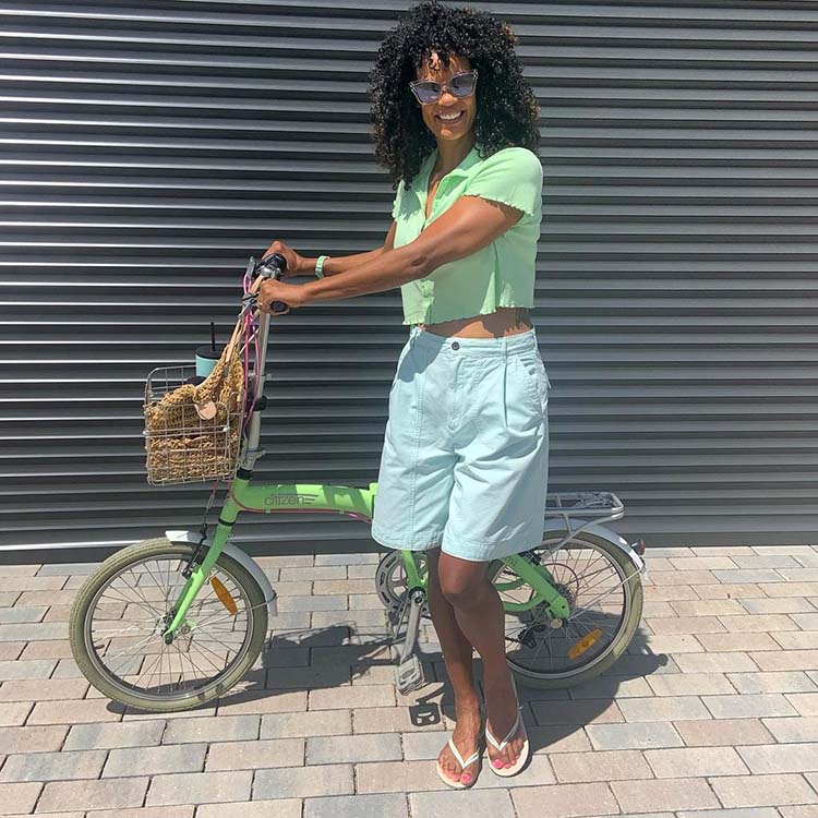 Diane wears blue shorts and a green top | 40plusstyle.com