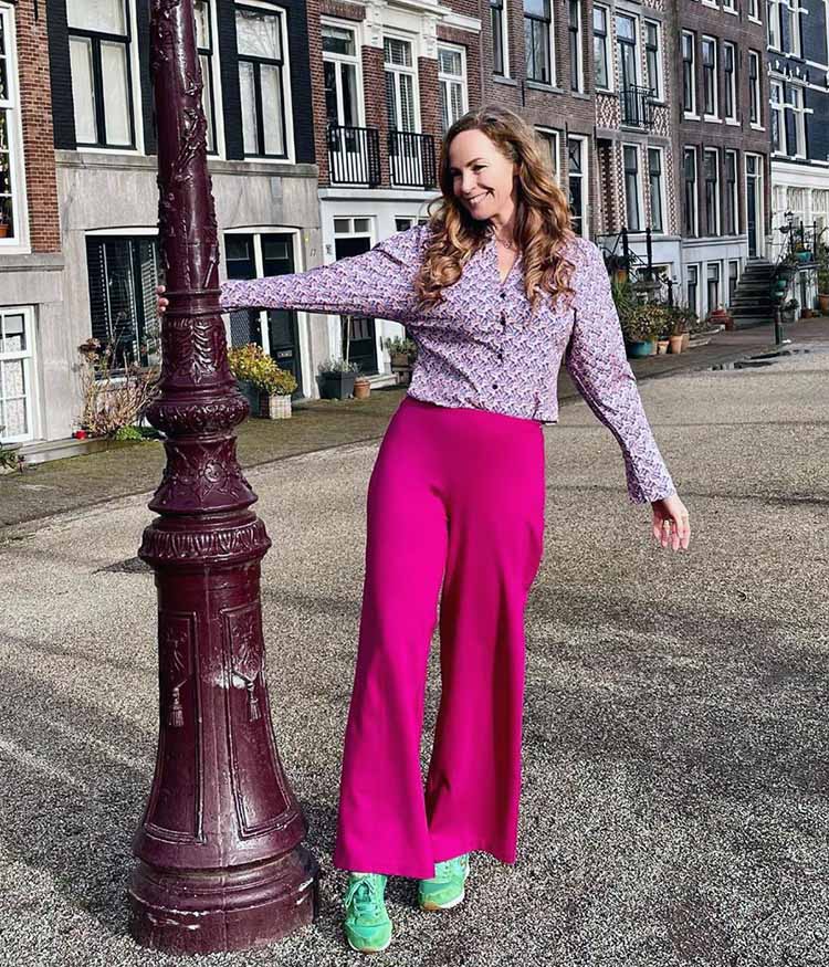 How to dress when you have a big bust - Claudia wears a print blouse and bright pants | 40plusstyle.com