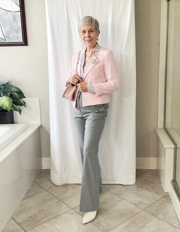 Eileen wears a pink jacket and gray pants | 40plusstyle.com