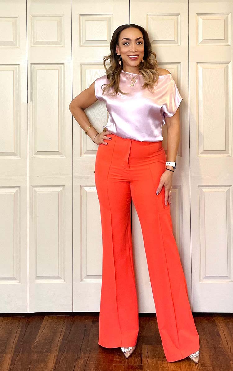 Erica in a pink top and orange pants | 40plusstyle.com